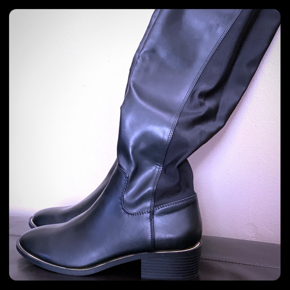 Material Girl brand riding boots with a gold strip